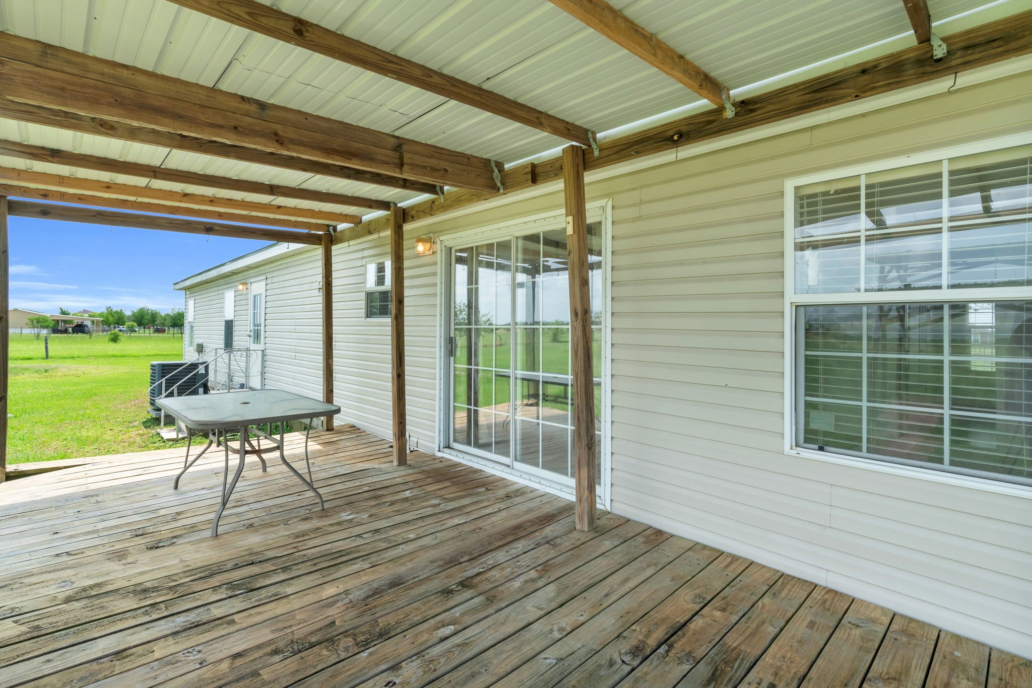 37038 Bell Road Waller, TX 77484 - Photo 9 of 43 a view of a porch with furniture and a backyard