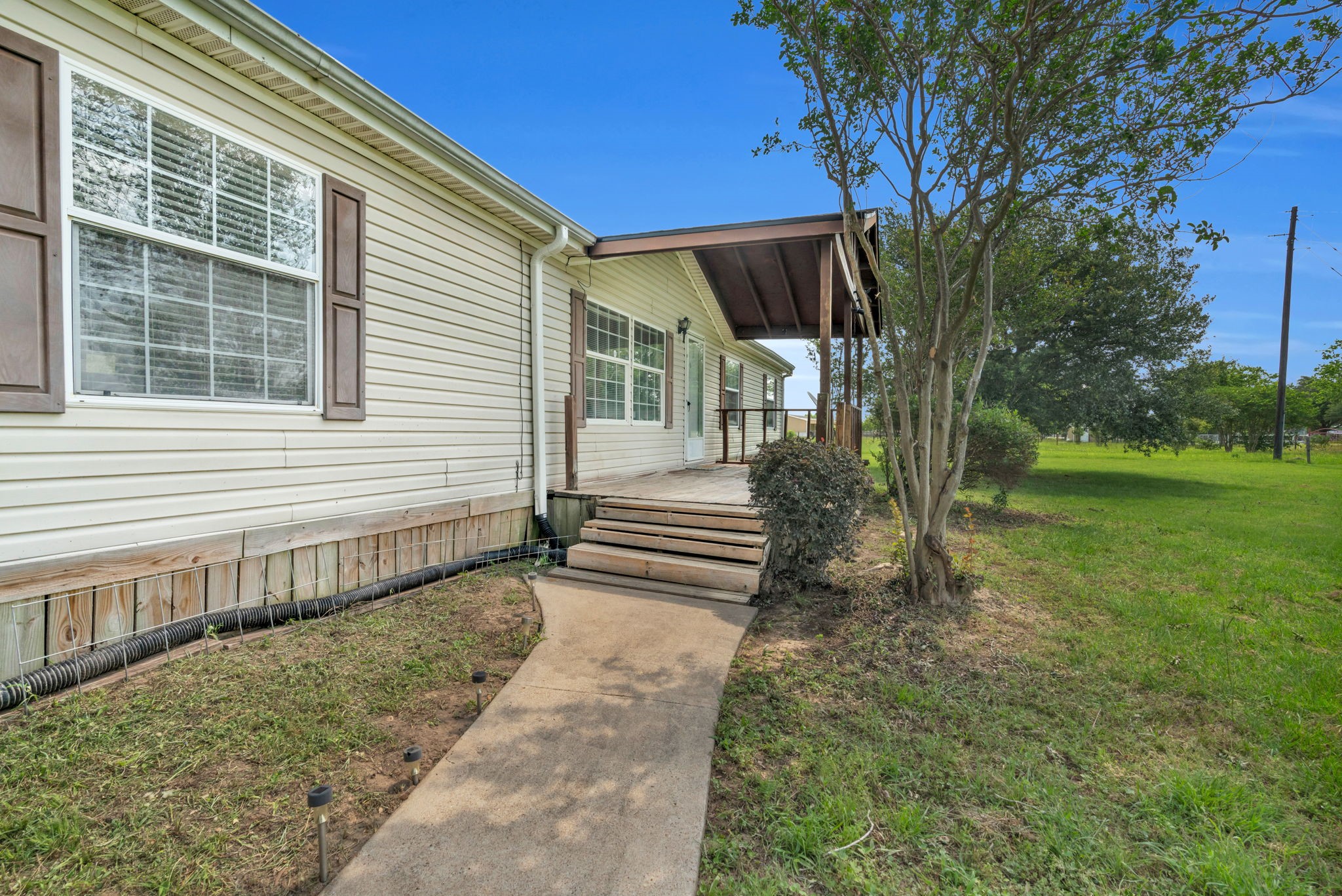 37038 Bell Road Waller, TX 77484 - Photo 10 of 43 a view of a house with a yard