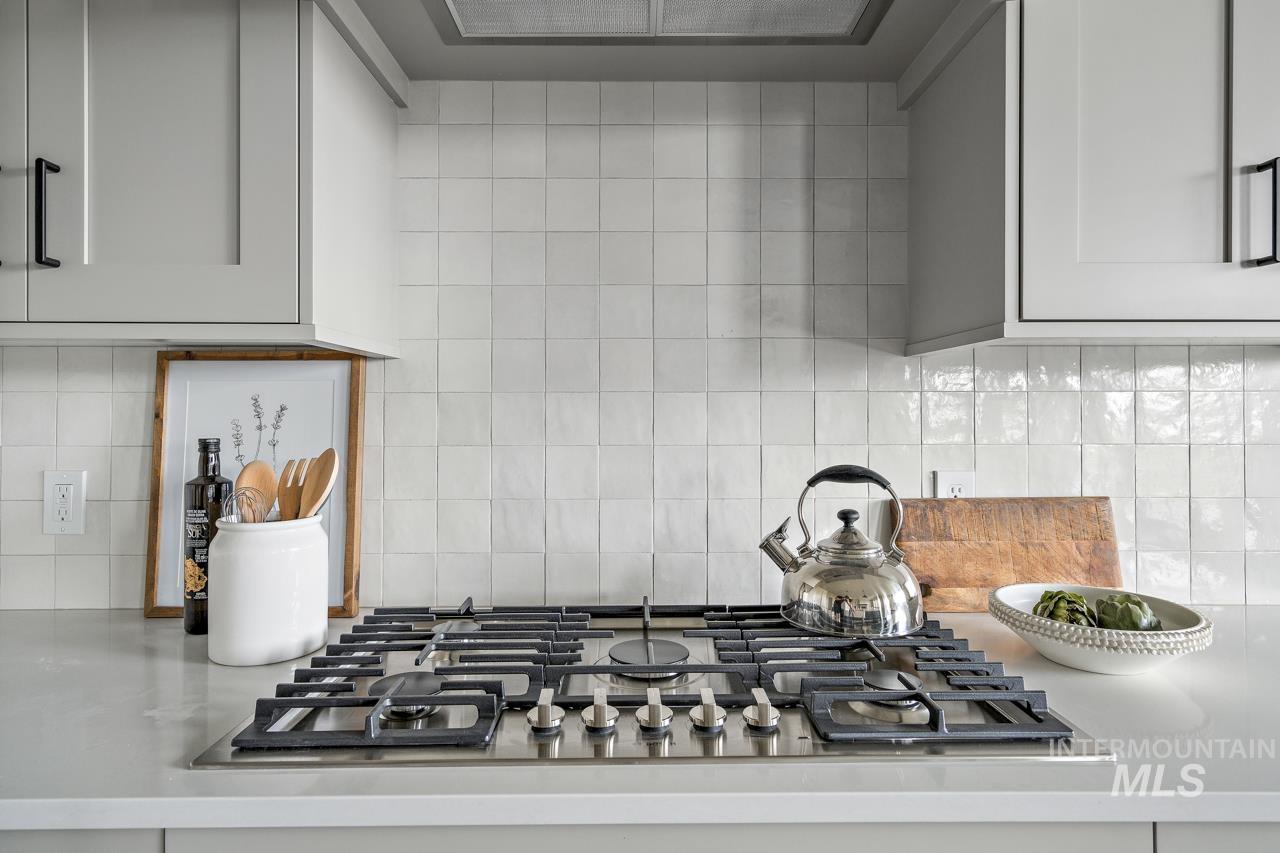 1101 East Crescendo Street Meridian, ID 83642 - Photo 17 of 31 Kitchen view of stainless steel gas stovetop and tasteful backsplash
