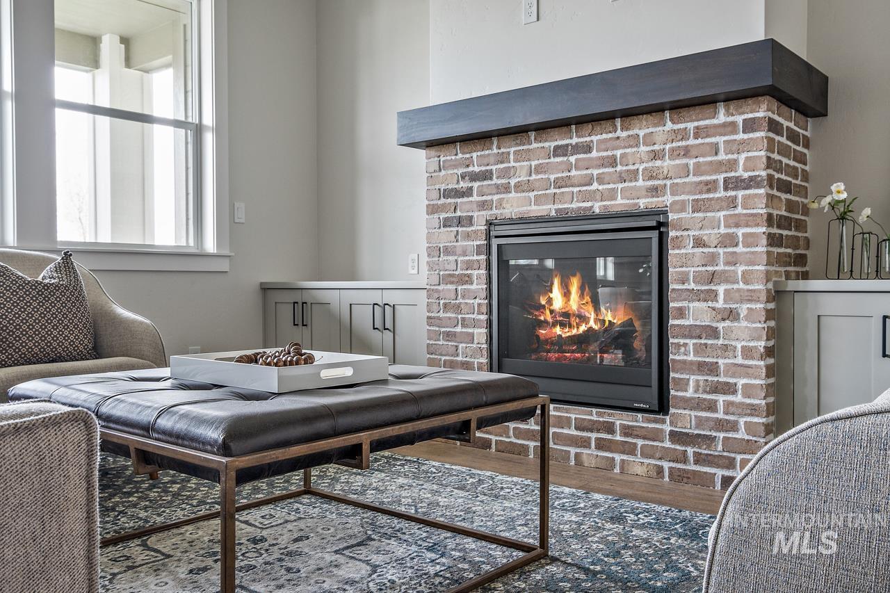 1101 East Crescendo Street Meridian, ID 83642 - Photo 8 of 31 Living room with wood finished floors and a fireplace