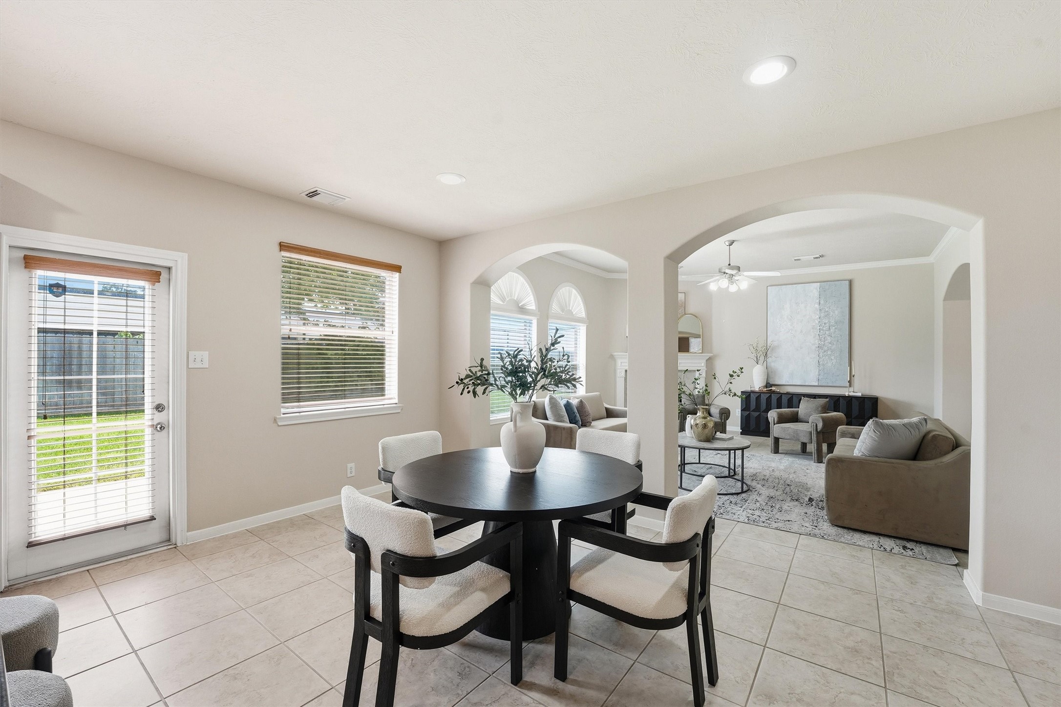 17415 Memorial Mills Drive Spring, TX 77379 - Photo 12 of 37 This casual dining/breakfast area separates the kitchen from the main living area. However, the giant arched openings connect the spaces beautifully.