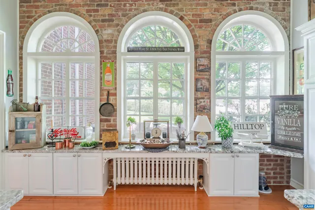 a view of hall way with furniture