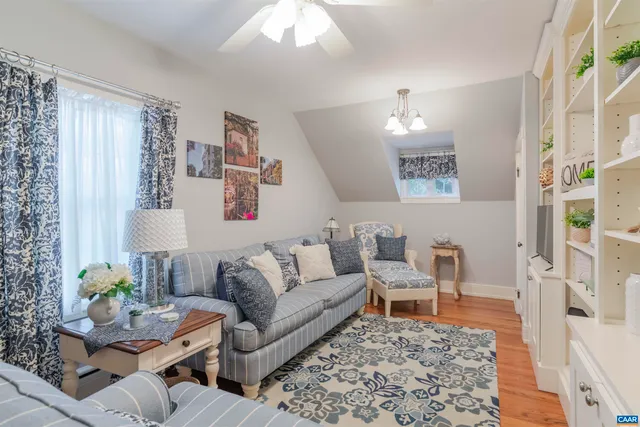 a living room with furniture and a rug