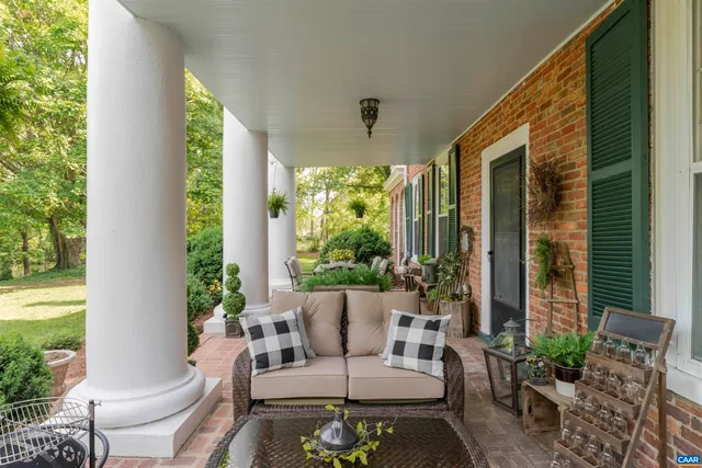 a outdoor space with patio the couches and a potted plant on a table
