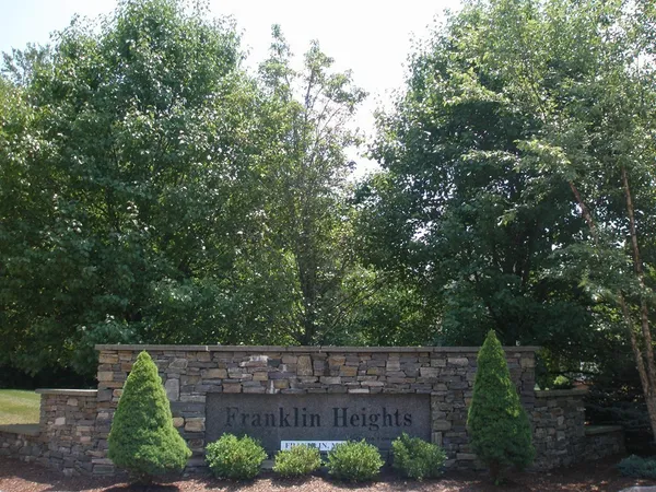a view of house with trees in the background