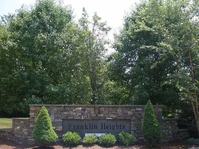 a view of house with trees in the background