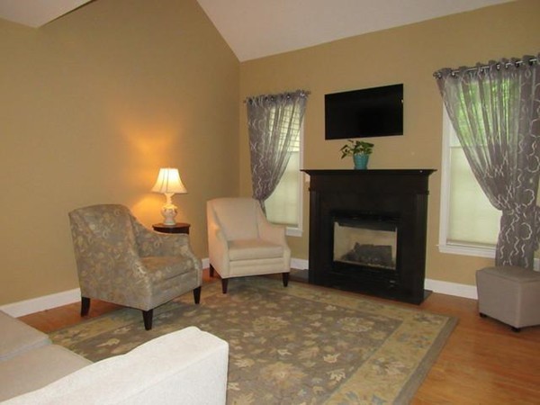 24 Leanne Way, Unit 24 Franklin, MA 02038 - Photo 8 of 18 a living room with furniture a fireplace and a flat screen tv