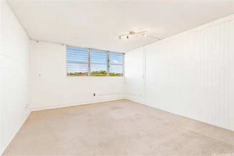 an empty room with a empty space and windows