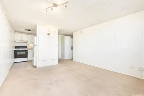 a kitchen with granite countertop cabinets stainless steel appliances and sink