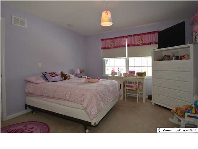 39 Great Bridge Road Freehold, NJ 07728 - Photo 21 of 24 a bedroom with a bed and a window