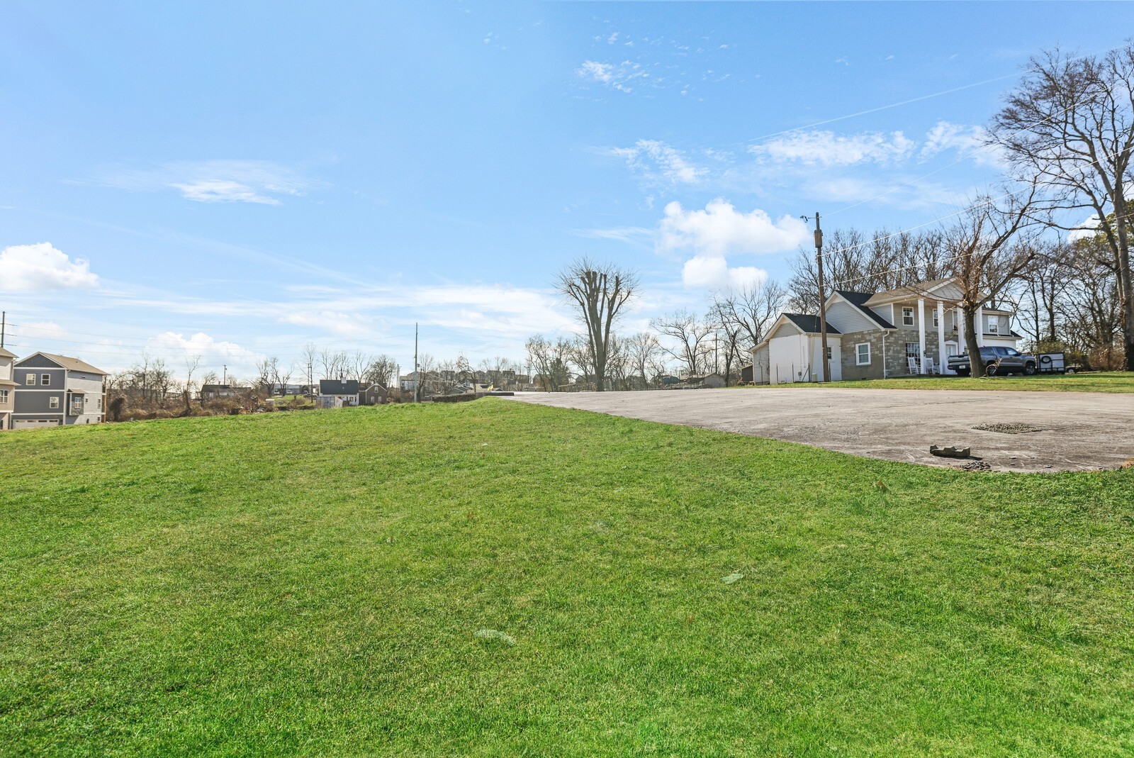 123 East Campbell Road Madison, TN 37115 - Photo 11 of 17 a backyard of a house with lots of green space and lake view