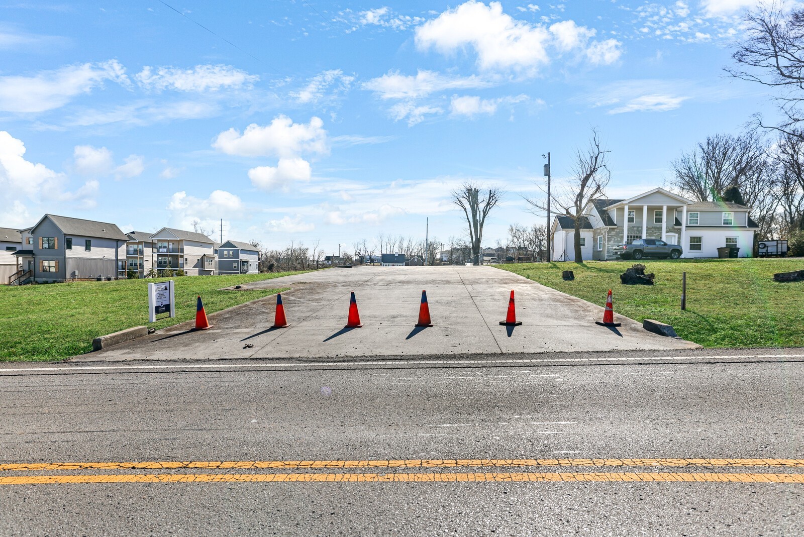 123 East Campbell Road Madison, TN 37115 - Photo 3 of 17 a view of road with grass and small trees