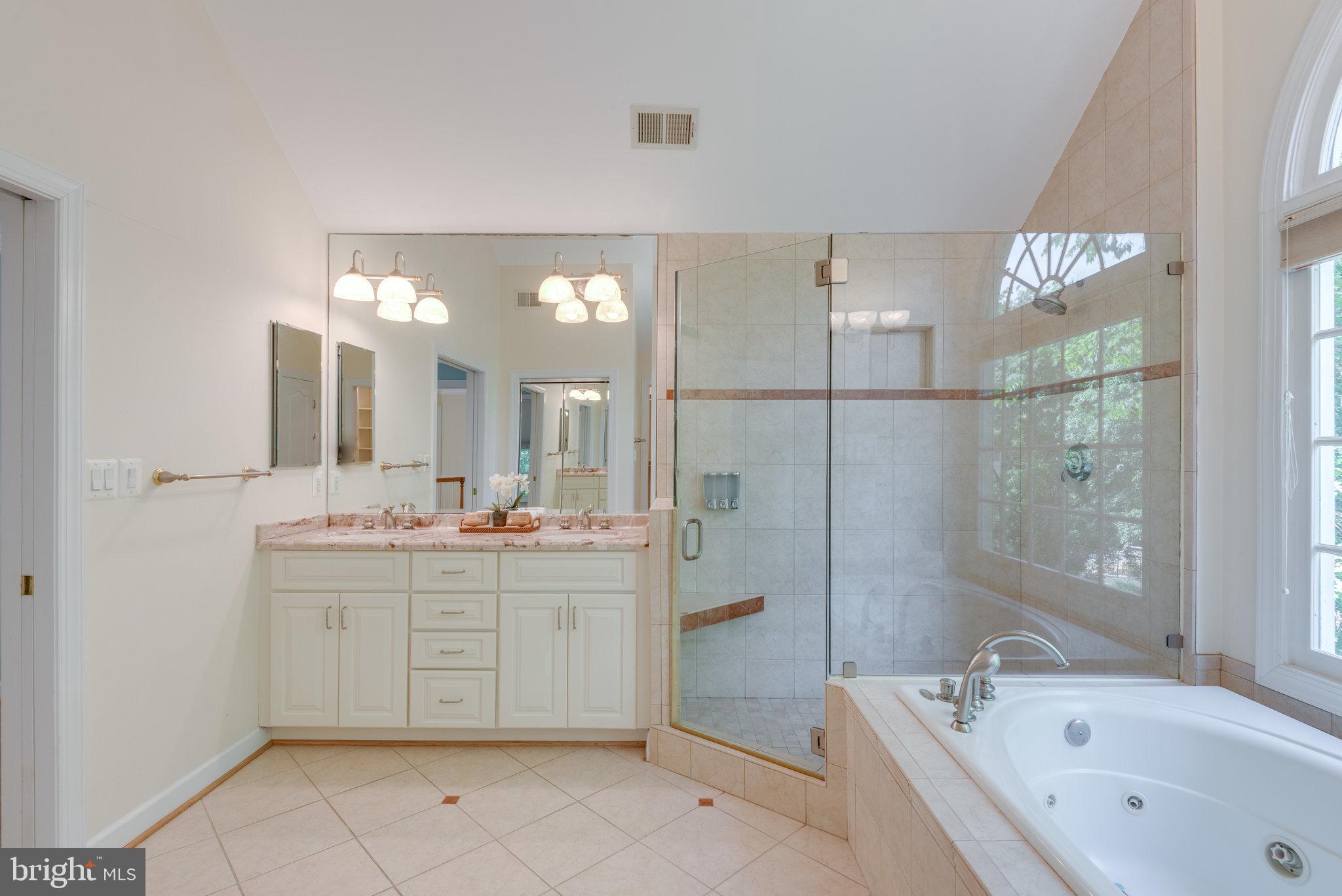 12104 North Walnut Branch Road Reston, VA 20194 - Photo 35 of 70 Walk-in shower and dual sink vanity