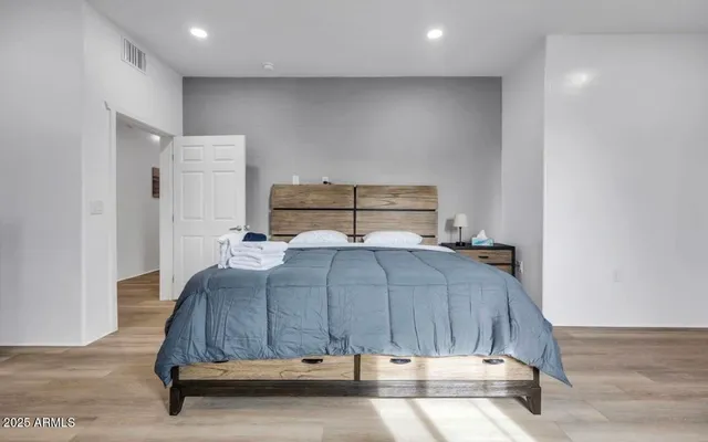 a bedroom with a bed and window