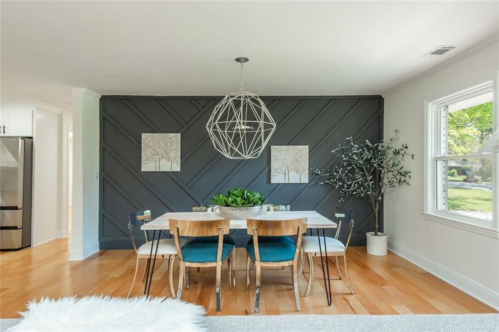 3365 Ardley Road Southwest Atlanta, GA 30311 - Photo 19 of 62 a view of a dining room with furniture window and wooden floor