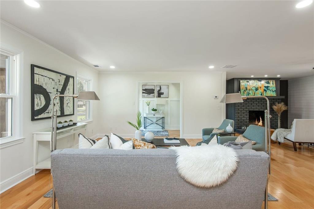3365 Ardley Road Southwest Atlanta, GA 30311 - Photo 21 of 62 a living room with fireplace furniture and a wooden floor