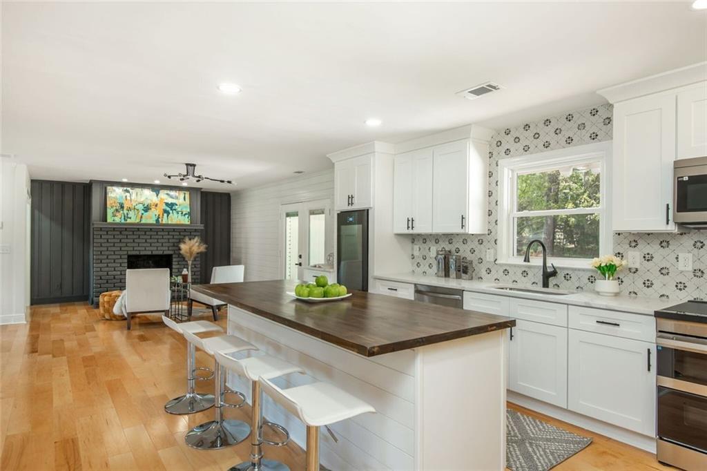 3365 Ardley Road Southwest Atlanta, GA 30311 - Photo 30 of 62 a kitchen with a sink appliances and cabinets