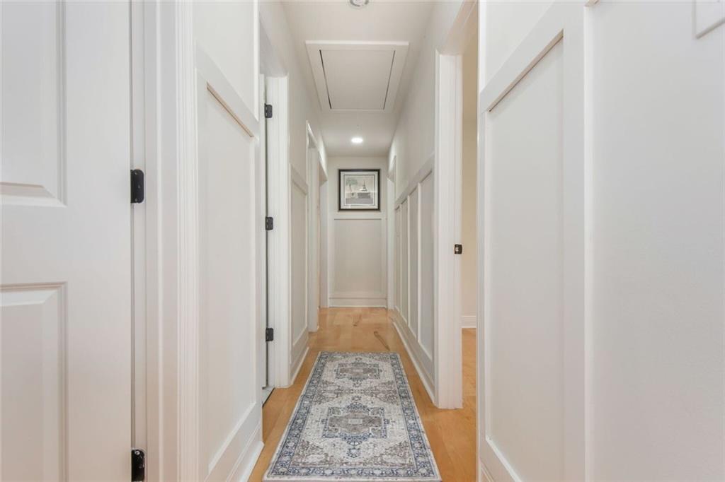 3365 Ardley Road Southwest Atlanta, GA 30311 - Photo 39 of 62 a view of a hallway with wooden floor and staircase