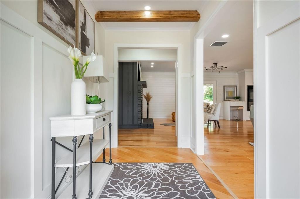3365 Ardley Road Southwest Atlanta, GA 30311 - Photo 4 of 62 a view of a hallway to a livingroom with furniture and wooden floor