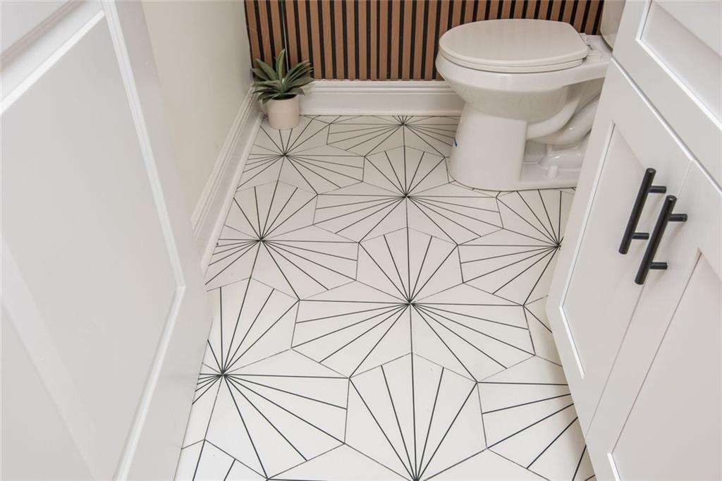 3365 Ardley Road Southwest Atlanta, GA 30311 - Photo 52 of 62 a white toilet sitting next to a white wall