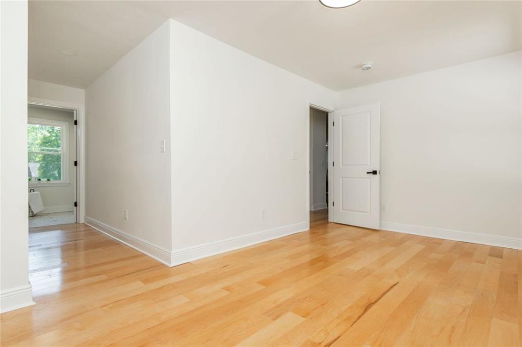 3365 Ardley Road Southwest Atlanta, GA 30311 - Photo 55 of 62 an empty room with wooden floor