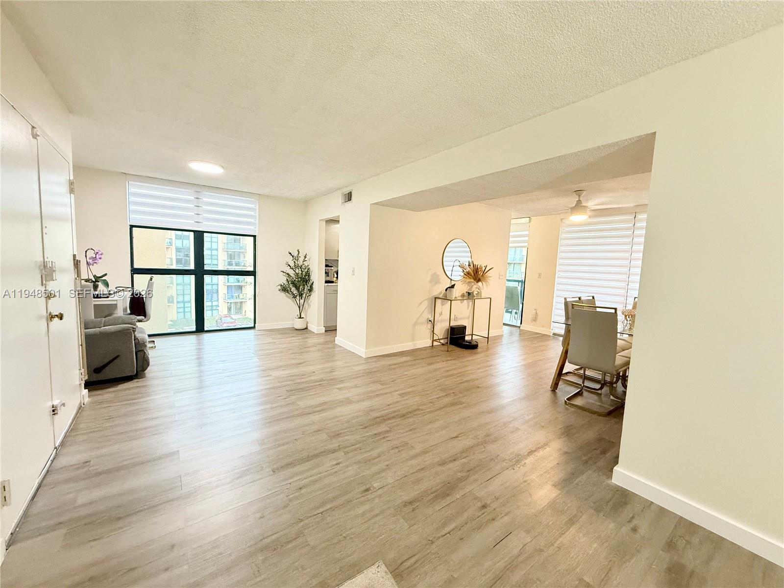 11800 Southwest 18th Street, Unit 4104 Miami, FL 33175 - Photo 10 of 10 a view of a livingroom with furniture and a window