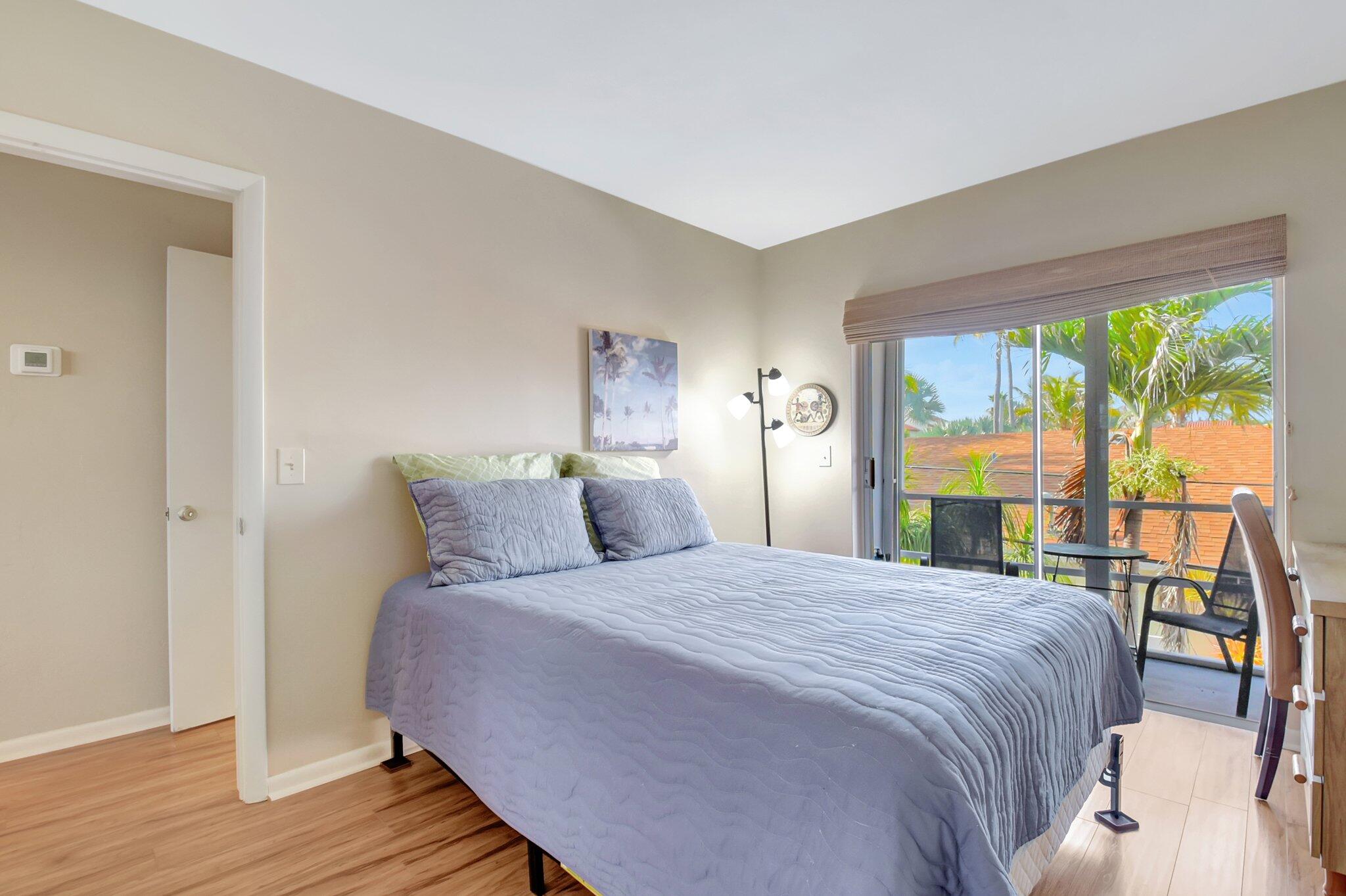 5505 North Ocean Boulevard, Unit 8202 Ocean Ridge, FL 33435 - Photo 14 of 26 a bedroom with a large bed and a large window