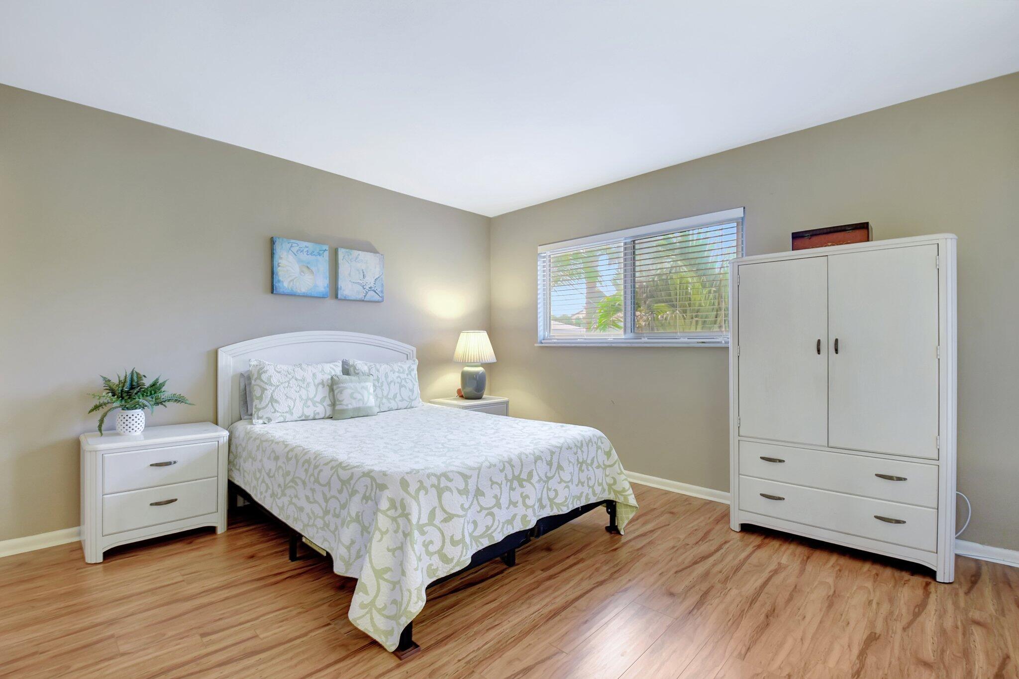 5505 North Ocean Boulevard, Unit 8202 Ocean Ridge, FL 33435 - Photo 17 of 26 a bedroom with a large bed and a window