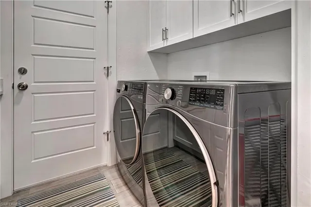 a utility room with washer and dryer