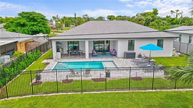 a house view with a garden space and outdoor seating