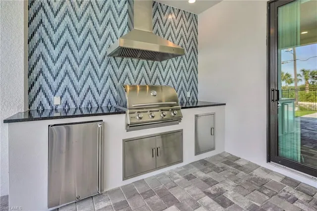 a view of a kitchen with a stove top oven