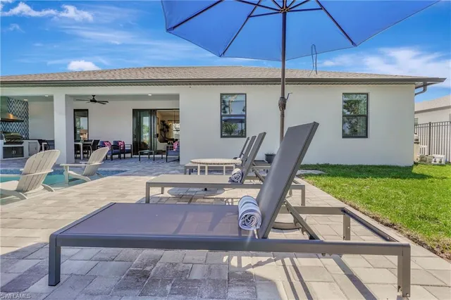a view of a swimming pool with a patio