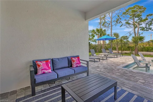 a outdoor living space with furniture and a potted plant