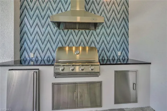 a view of a door with a sink and wooden floor