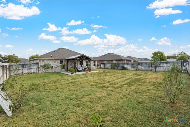 a view of a house with a big yard