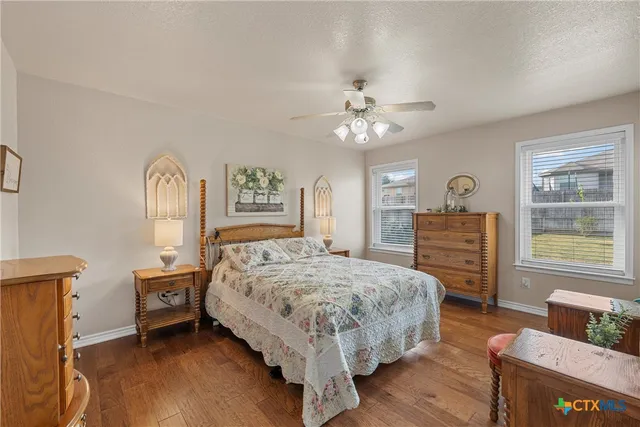 a living room with a bed furniture and a window