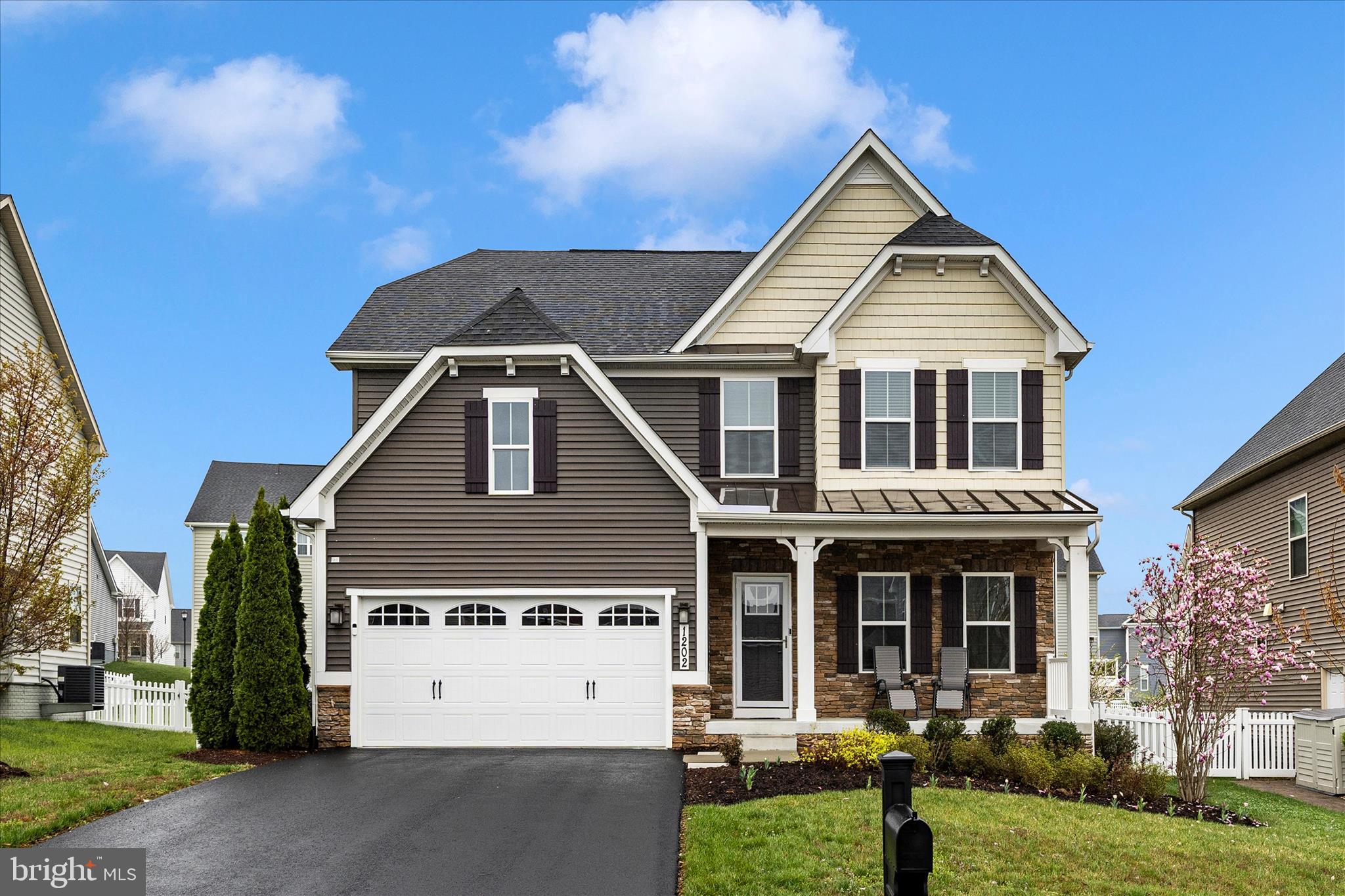 1202 Dargon Quarry Lane Brunswick, MD 21716 - Photo 1 of 76 a view of multiple houses with a yard