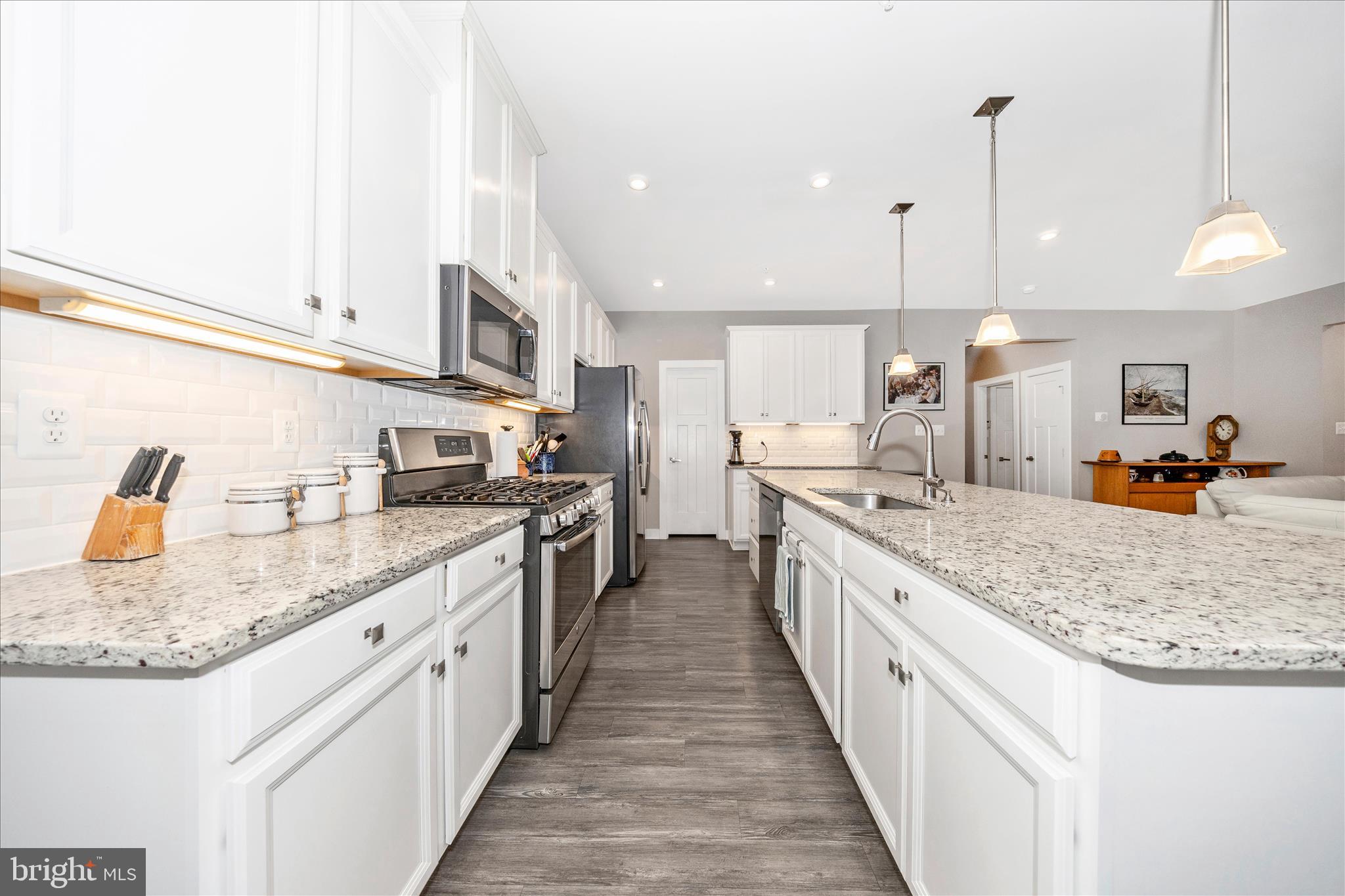 1202 Dargon Quarry Lane Brunswick, MD 21716 - Photo 14 of 76 a large kitchen with stainless steel appliances kitchen island granite countertop a large counter top and a sink