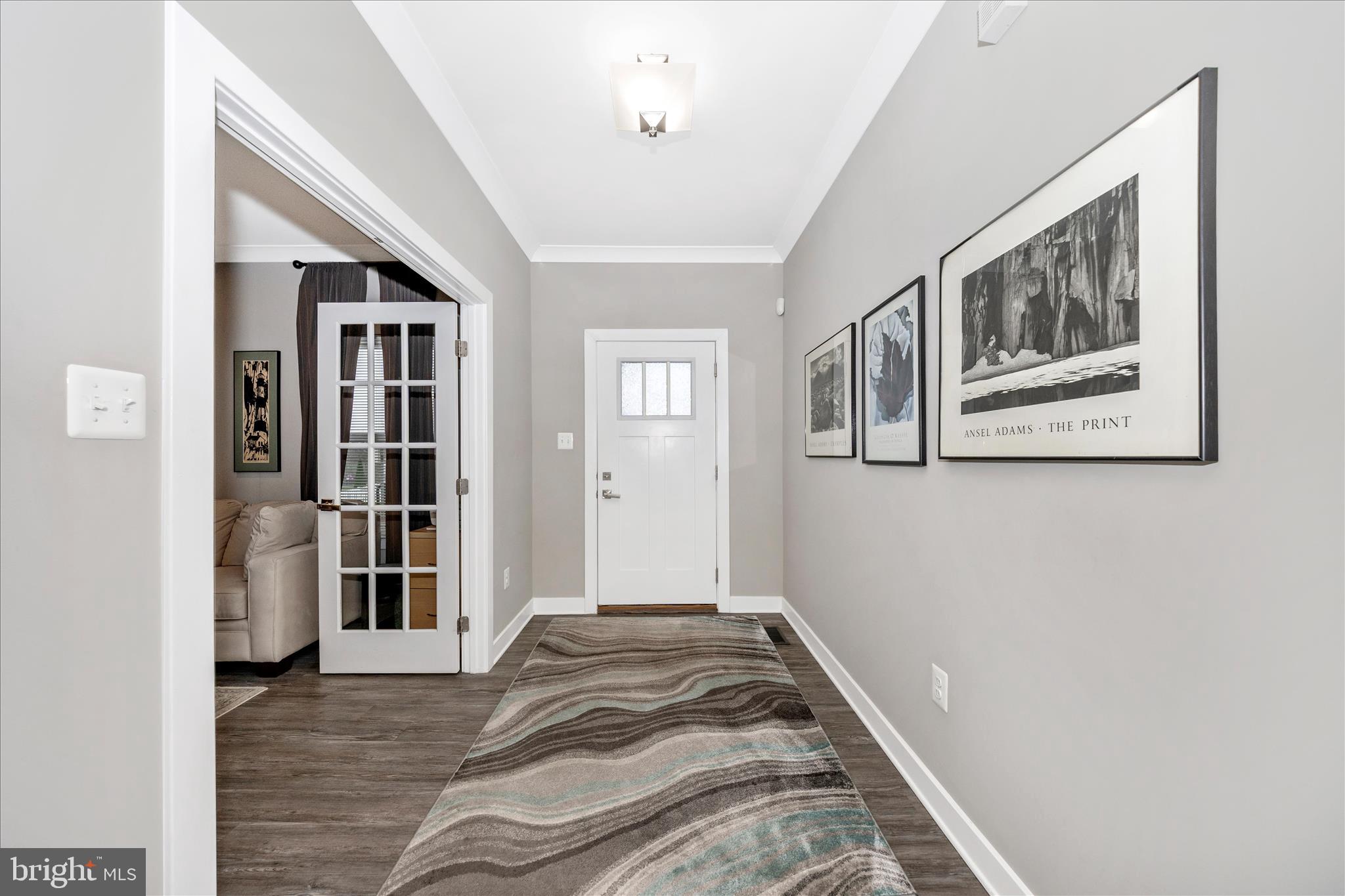 1202 Dargon Quarry Lane Brunswick, MD 21716 - Photo 2 of 76 a view of a hallway with wooden floor and windows