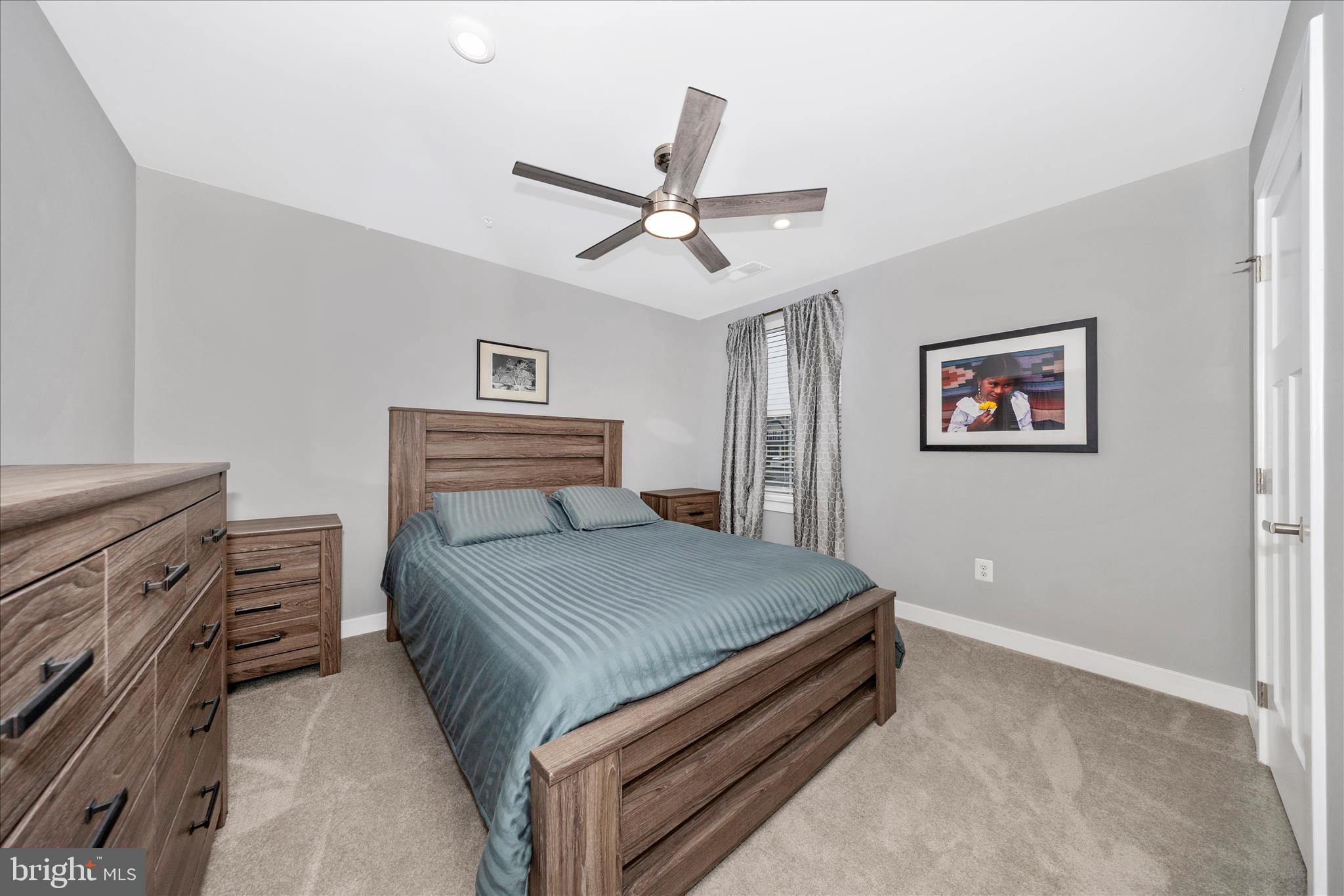 1202 Dargon Quarry Lane Brunswick, MD 21716 - Photo 32 of 76 a bedroom with a bed and a chandelier