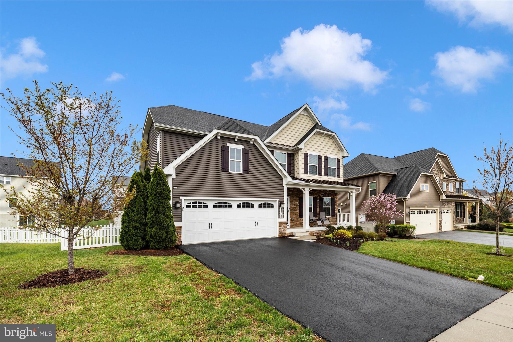 1202 Dargon Quarry Lane Brunswick, MD 21716 - Photo 39 of 76 a front view of a house with a yard and garage
