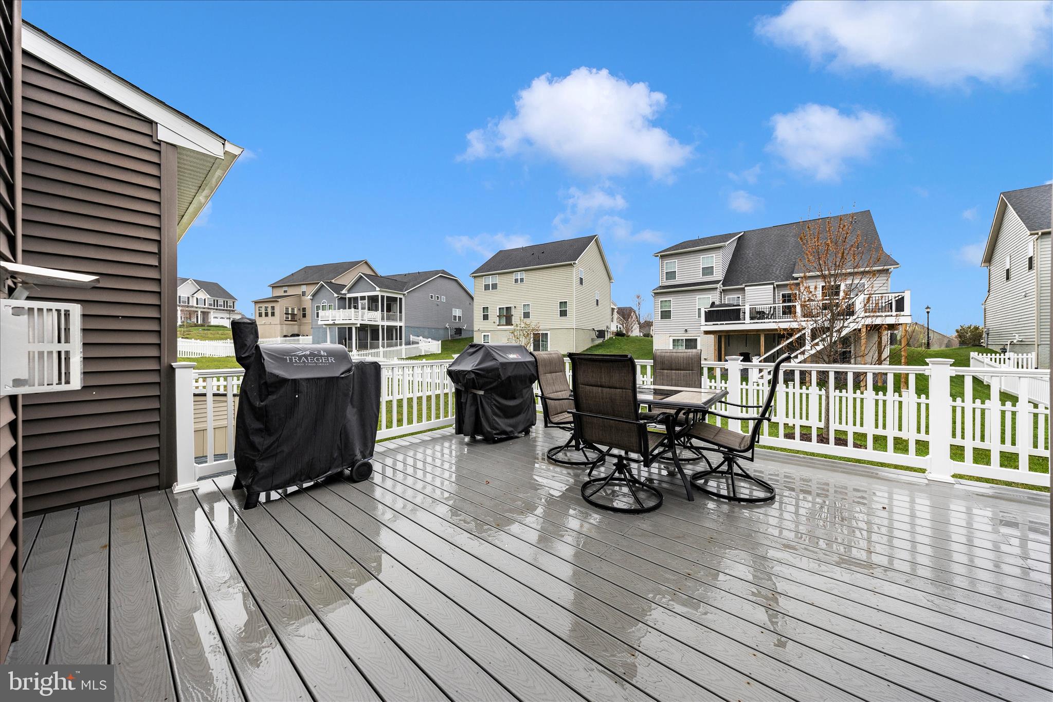 1202 Dargon Quarry Lane Brunswick, MD 21716 - Photo 51 of 76 a view of a rooftop deck with chairs and wooden floor