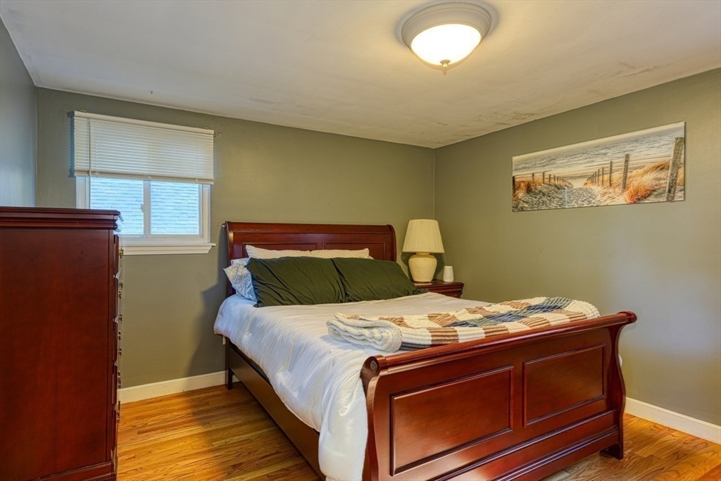 238 West Hill Road Marlborough, MA 01752 - Photo 11 of 30 a bed sitting in a bedroom next to a window
