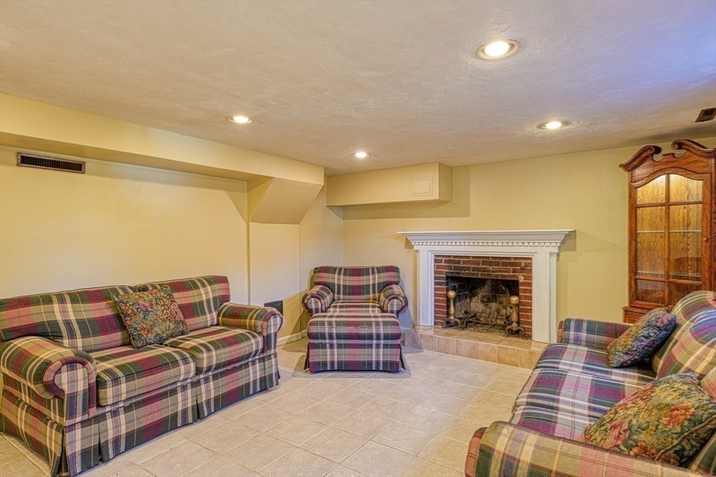 238 West Hill Road Marlborough, MA 01752 - Photo 16 of 30 a living room with furniture and a fireplace
