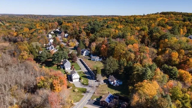 a aerial view of a house with a yard