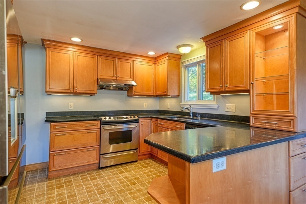 238 West Hill Road Marlborough, MA 01752 - Photo 6 of 30 a kitchen with stainless steel appliances granite countertop a stove a sink and a microwave