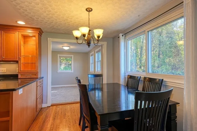 a view of a dining room with furniture window and outside view