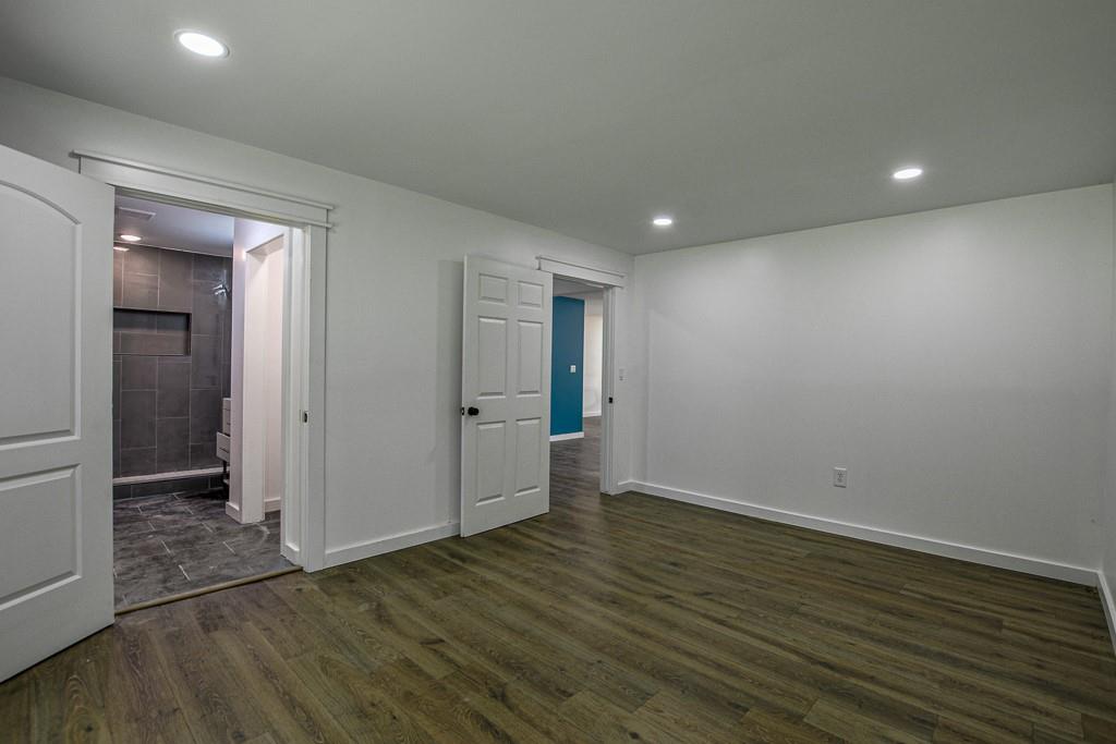 3349 Calhoun Road Northeast Rome, GA 30161 - Photo 16 of 30 a view of an empty room with wooden floor and closet