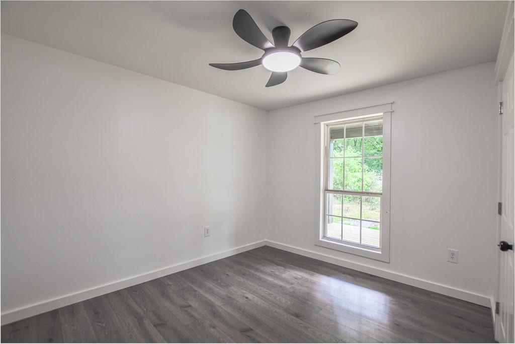 3349 Calhoun Road Northeast Rome, GA 30161 - Photo 20 of 30 an empty room with a window and a fan
