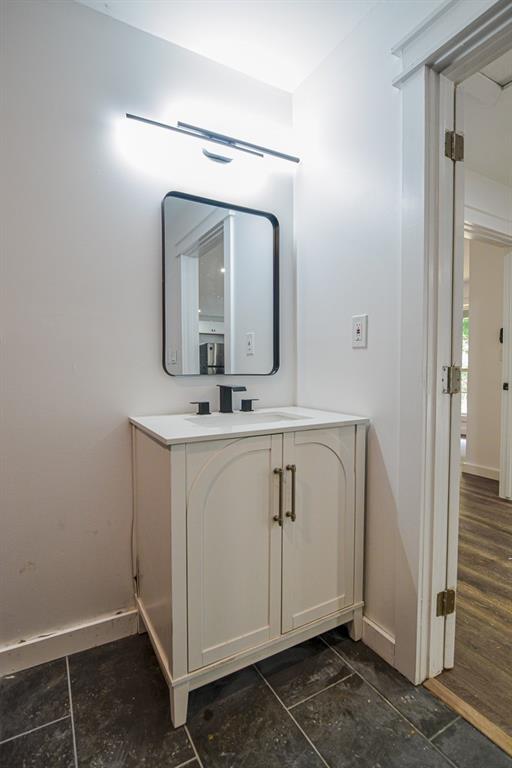 3349 Calhoun Road Northeast Rome, GA 30161 - Photo 22 of 30 a bathroom with a sink mirror and vanity